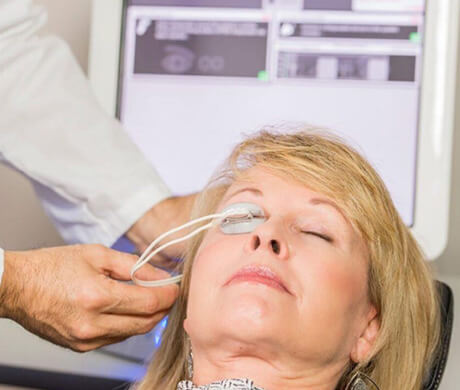 Woman undergoing LipiFlow treatment