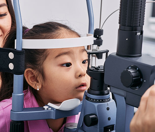 Little girl undergoing pediatric eye exam