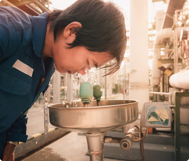 Man washing his eyes in faucet for emergency eyecare at Positive Eye Ons