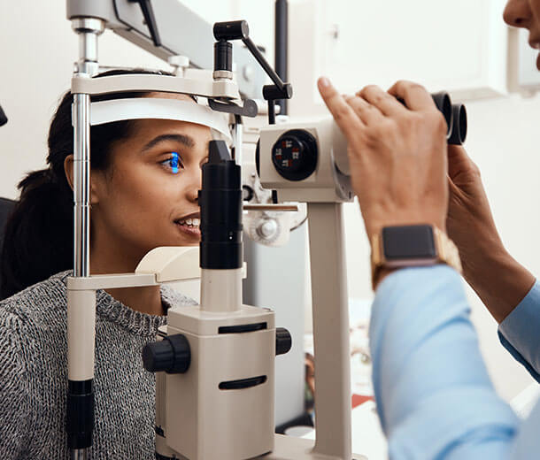 Woman undergoing contact lens eye exam